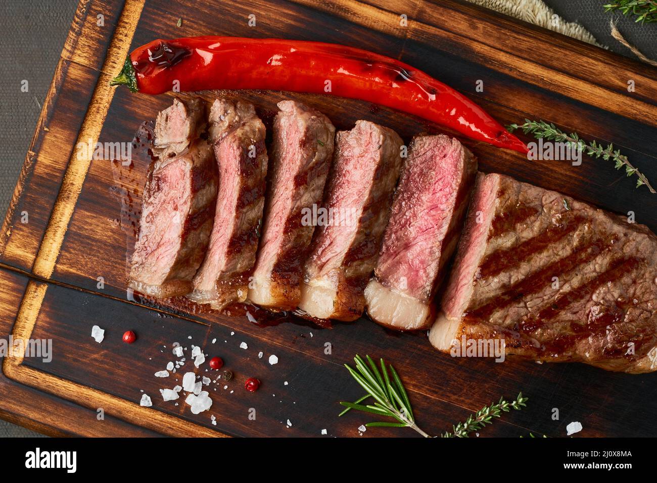 Keto ketogenic diet beef steak, grilled striploin on cutting board