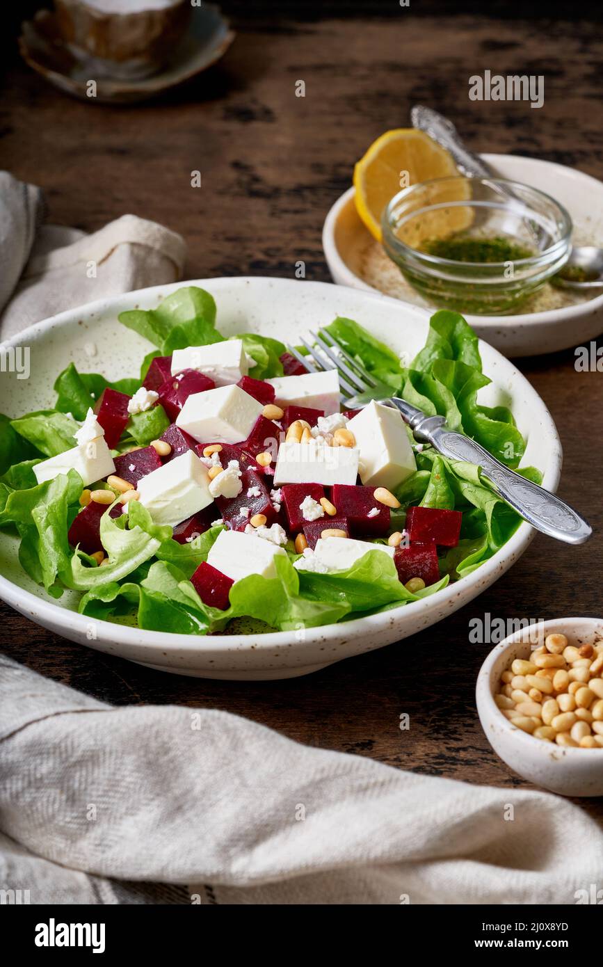 Healthy salad with beet, curd, feta and pine nuts, lettuce. Low carb