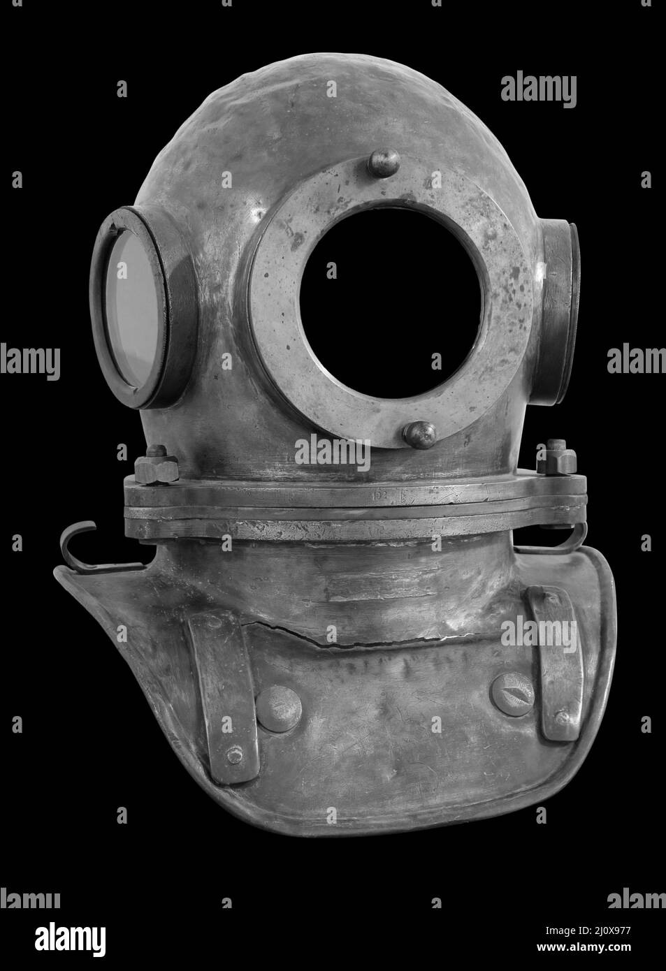 Old antique metal scuba helmet isolated on black background with clipping path Stock Photo