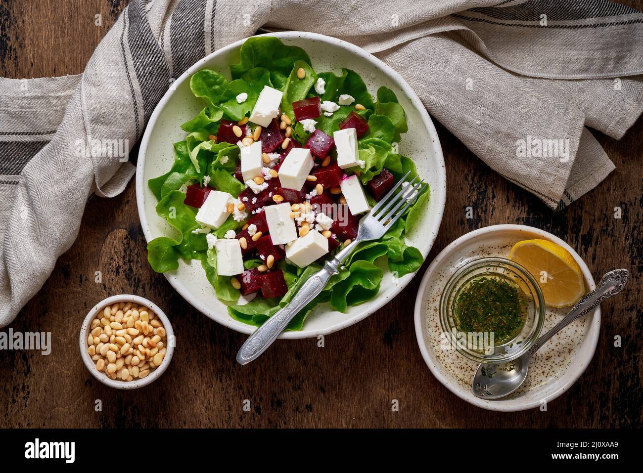 Healthy salad with beet, curd, feta and pine nuts, lettuce. Low carb