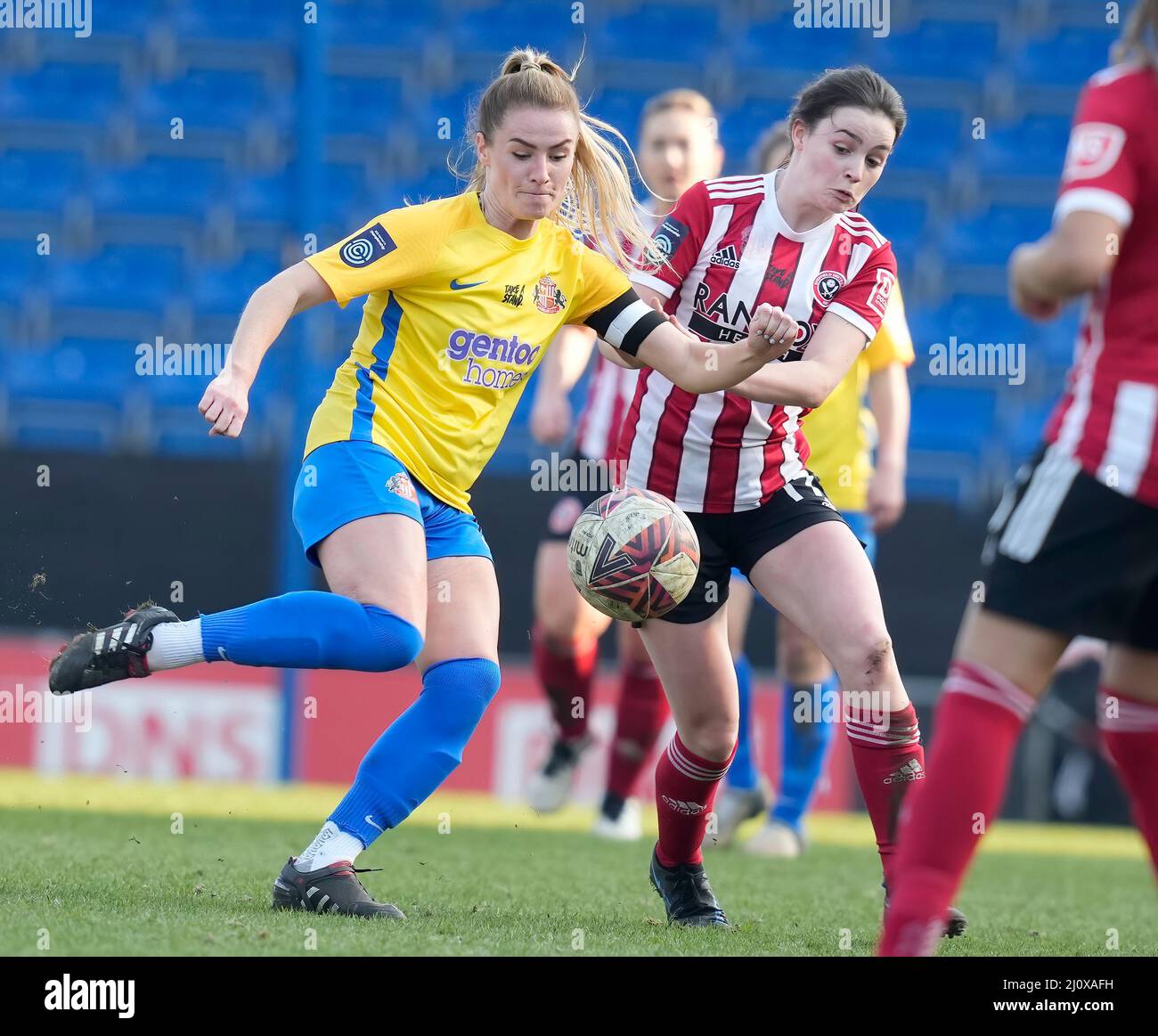 Chesterfield, England, 20th March 2022.  Matilda Taylor of Sheffield Utd (R) challenges Emma Kelly of Sunderland during the The FA Women's Championship match at the Technique Stadium, Chesterfield. Picture credit should read: Andrew Yates / Sportimage Credit: Sportimage/Alamy Live News Stock Photo