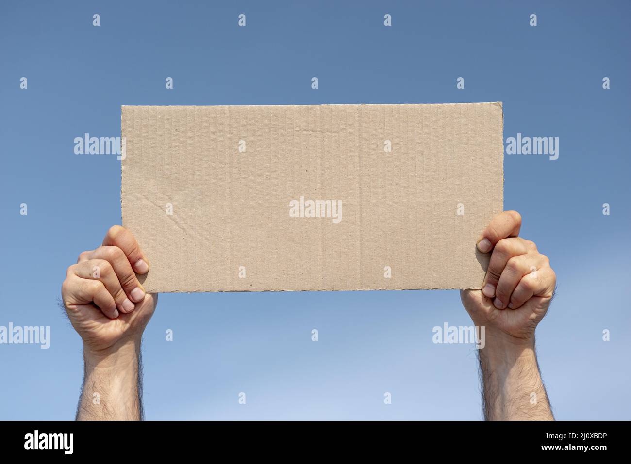 Protester holding board with mock up Stock Photo
