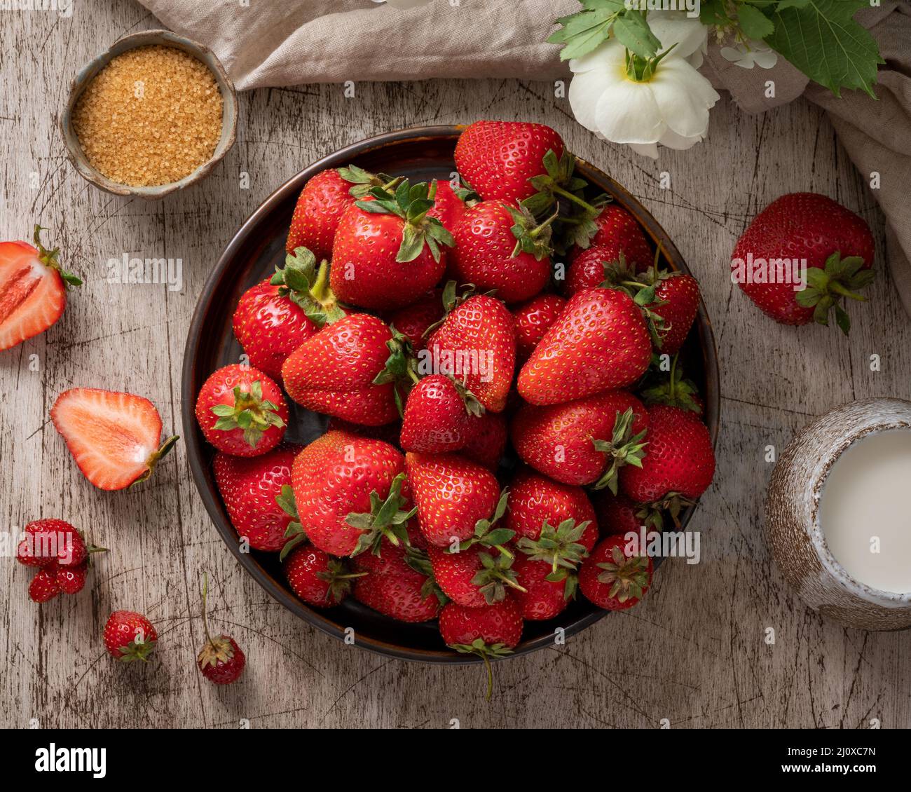 Dark still-life photo with summer strawberry, top view Stock Photo