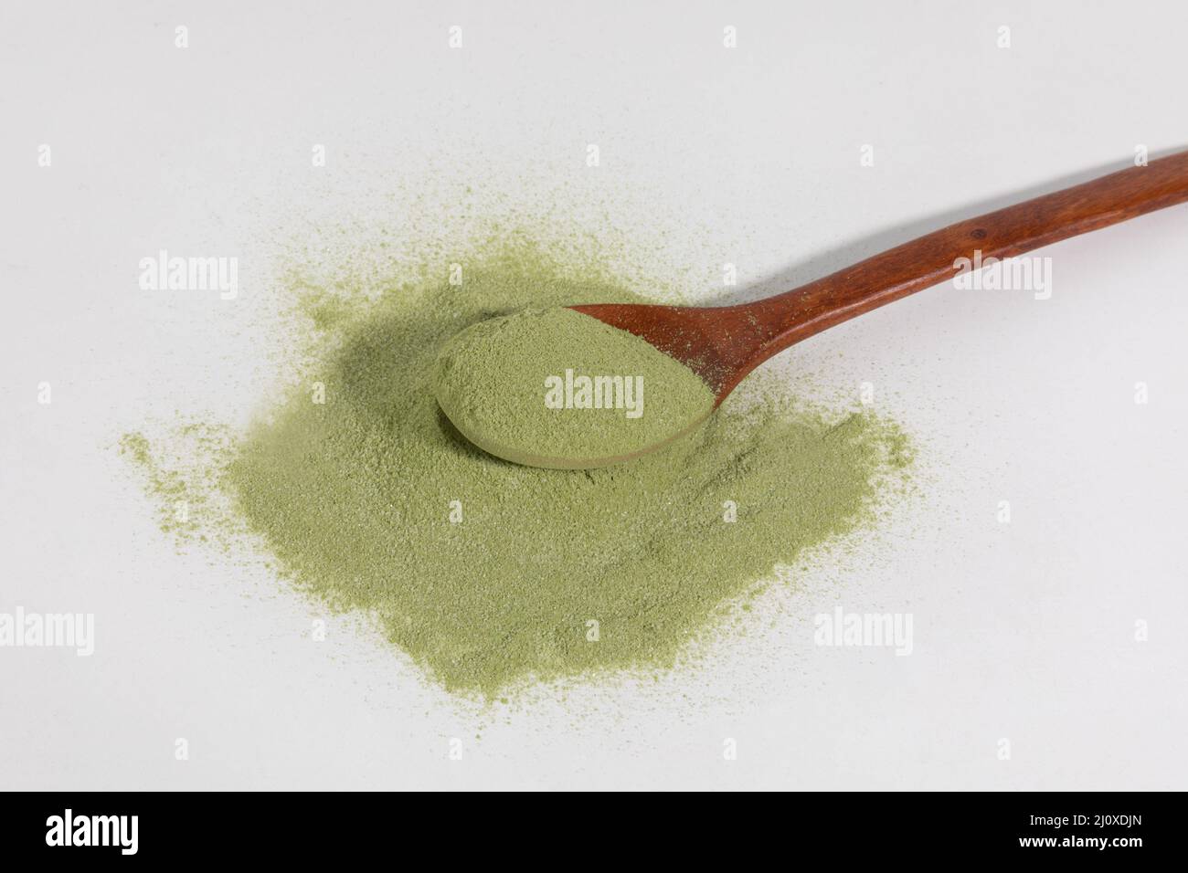Matcha green tea powder and spoon in white background Stock Photo Alamy