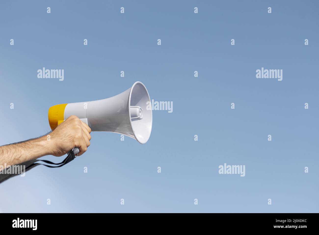 Protester holding megaphone demonstration. High quality photo Stock Photo