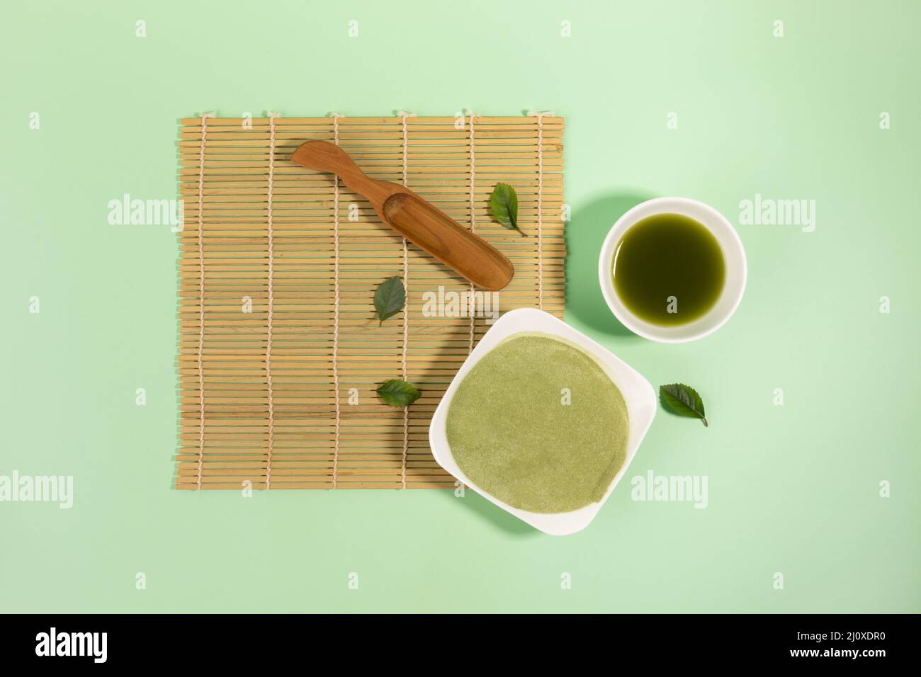matcha green tea powder and drink in green background Stock Photo Alamy