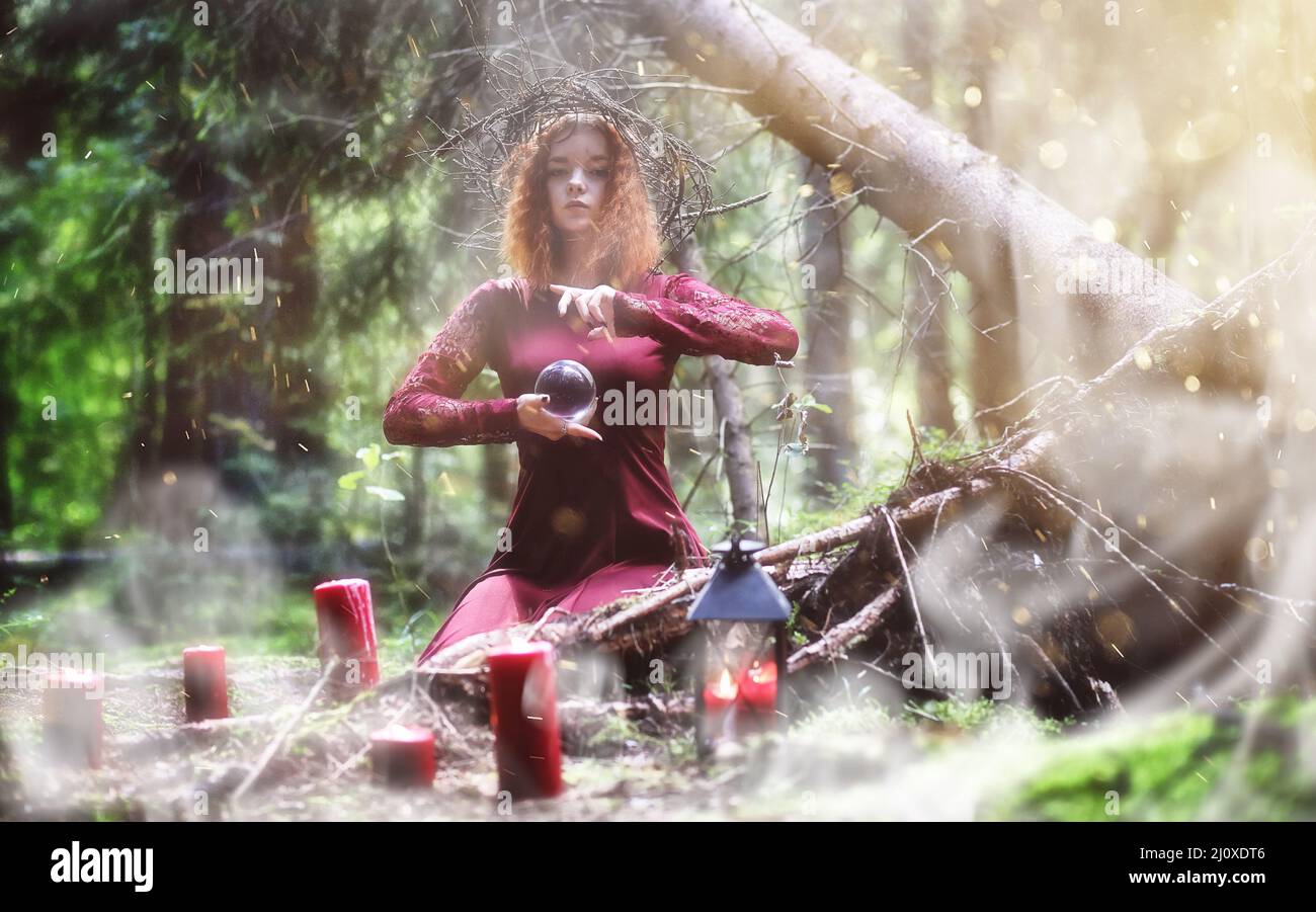 Witch Doing Rituals Witch holds a ritual in the depths of the forest Stock Photo - Alamy