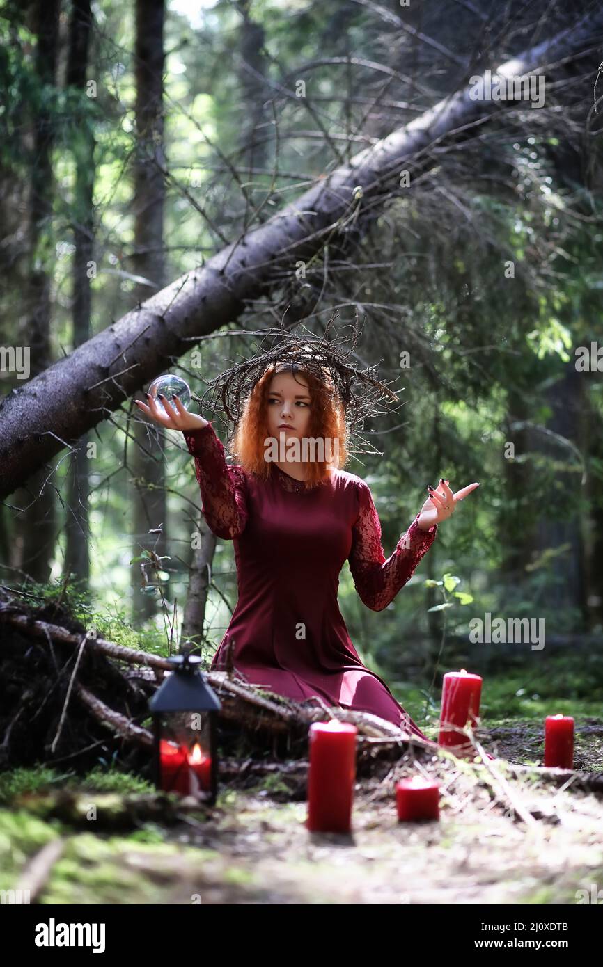 Witch holds a ritual in the depths of the forest Stock Photo - Alamy