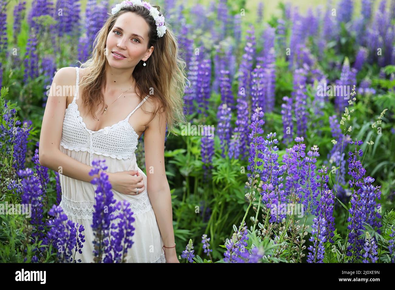 Beautiful girl with a bouquet of blue flowers on nature in summer Stock ...
