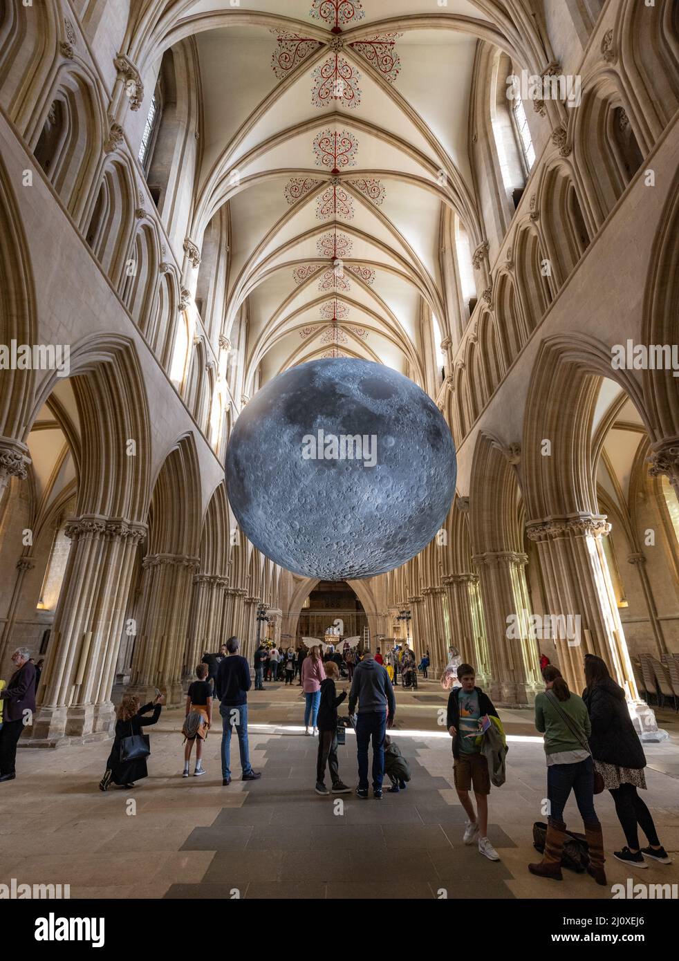 A seven-metre wide sculpture by Luke Jerram of the moon on display inside Wells Cathedral, Wells, Somerset, UK Stock Photo