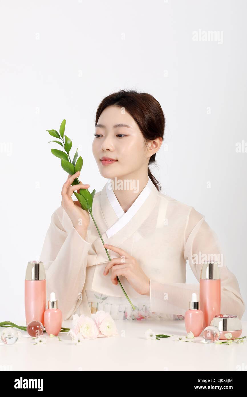 Asian Korean young woman wearing Hanbok Korean traditional clothes, cosmetics makeup beauty