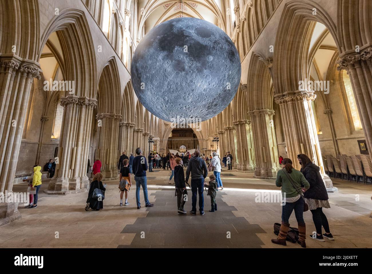A seven-metre wide sculpture by Luke Jerram of the moon on display inside Wells Cathedral, Wells, Somerset, UK Stock Photo