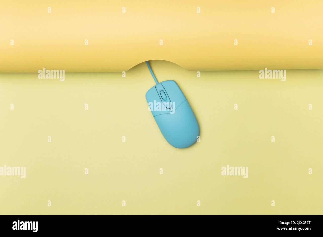 Top view blue computer mouse with yellow background. High quality photo Stock Photo