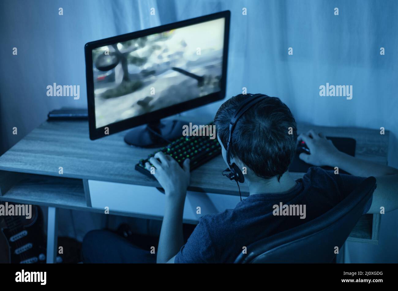 Young boy playing computer. High quality beautiful photo concept Stock Photo