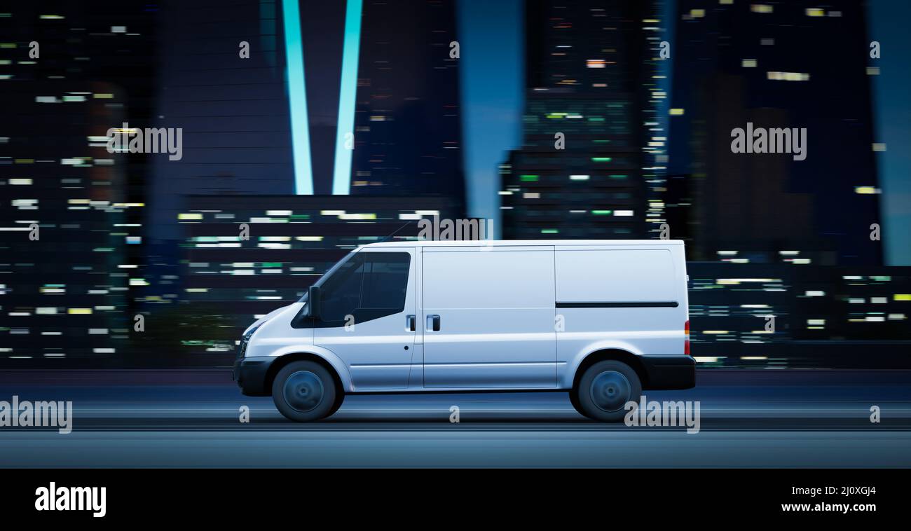 Delivery van driving on a city road at sunrise Stock Photo