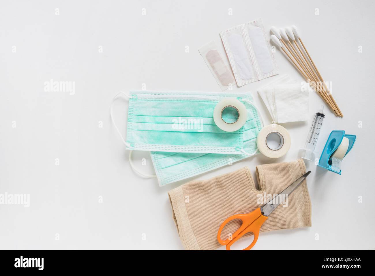 Surgical mask bandage gauze cotton swabs sticky bandage knee brace with scissor white background