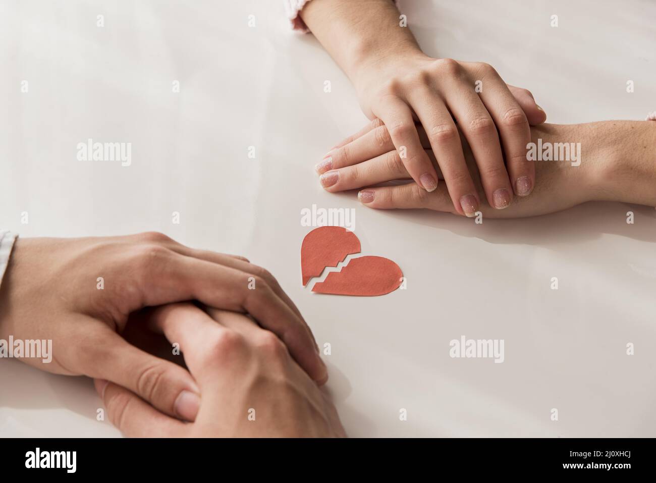 Close up hands with broken heart. High quality photo Stock Photo