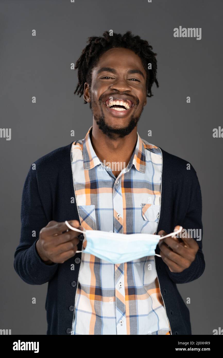 Taking mask off hires stock photography and images Alamy