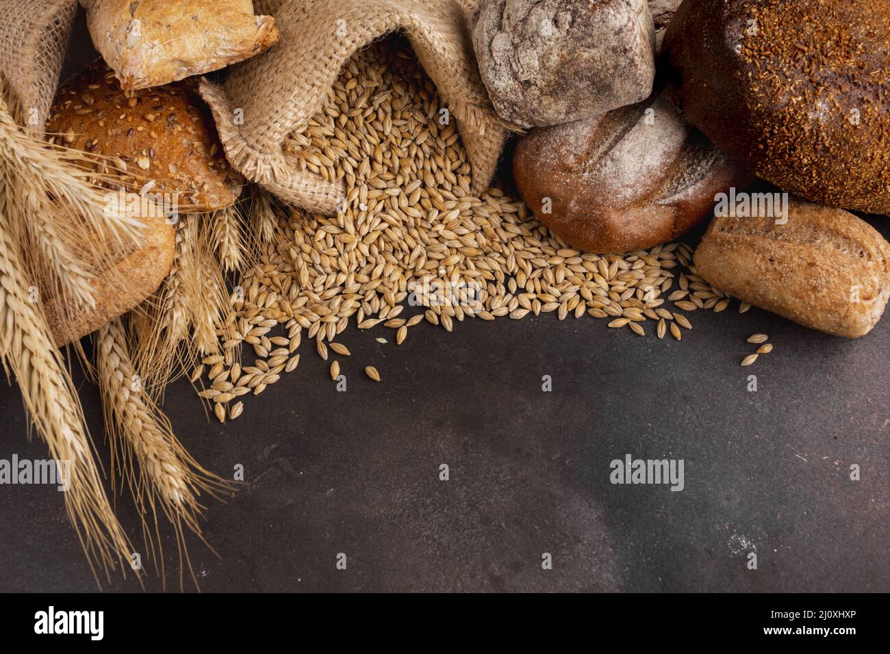 High angle wheat seeds spilling out jute bag. High quality beautiful photo concept Stock Photo