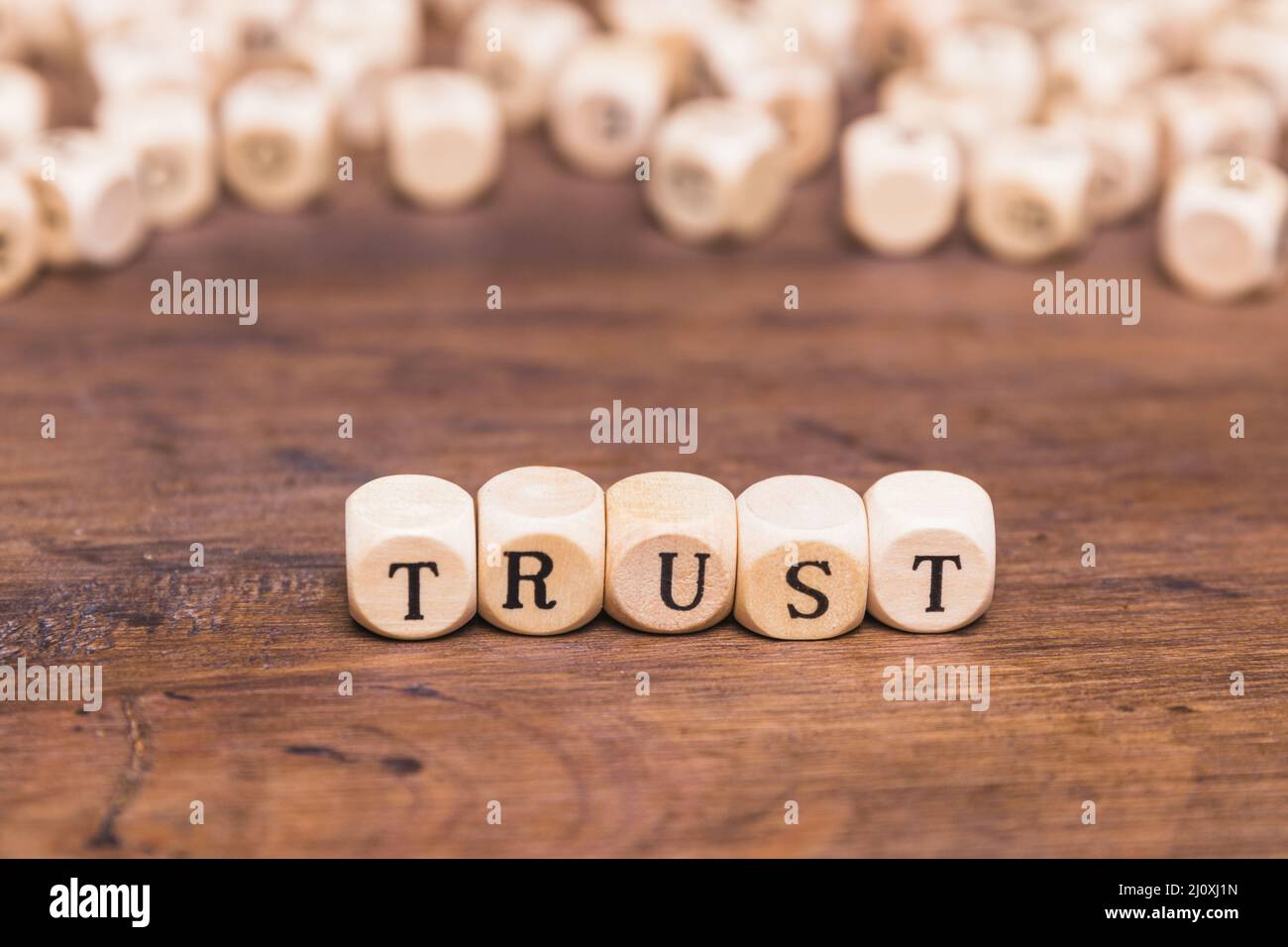 Trust word made with wooden blocks. High quality beautiful photo concept Stock Photo