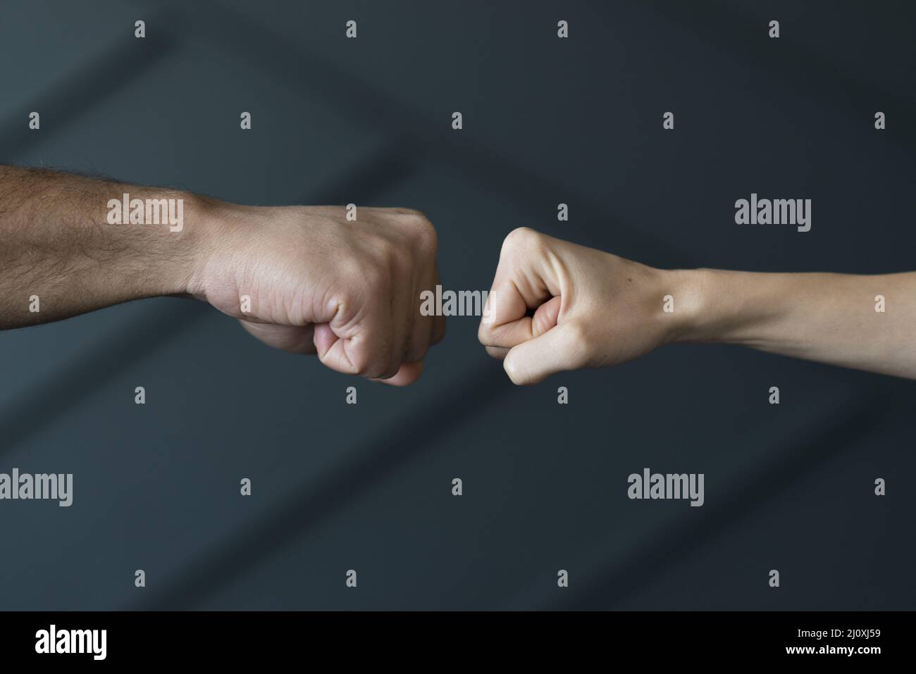 Close up friends ready touch fists Stock Photo