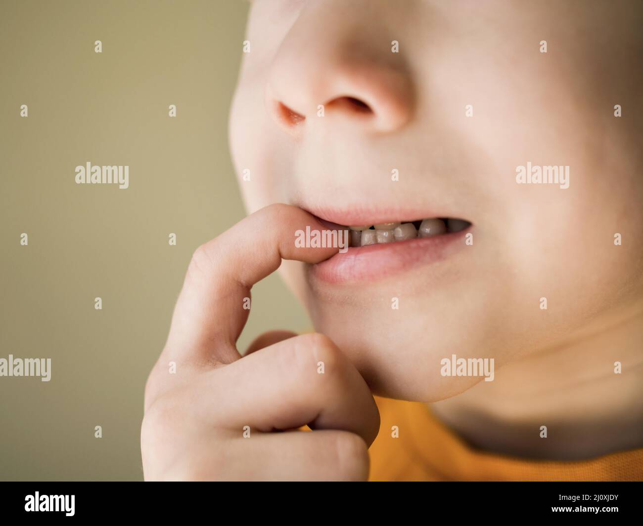 Front view nail biting bad habit concept. High quality photo Stock Photo