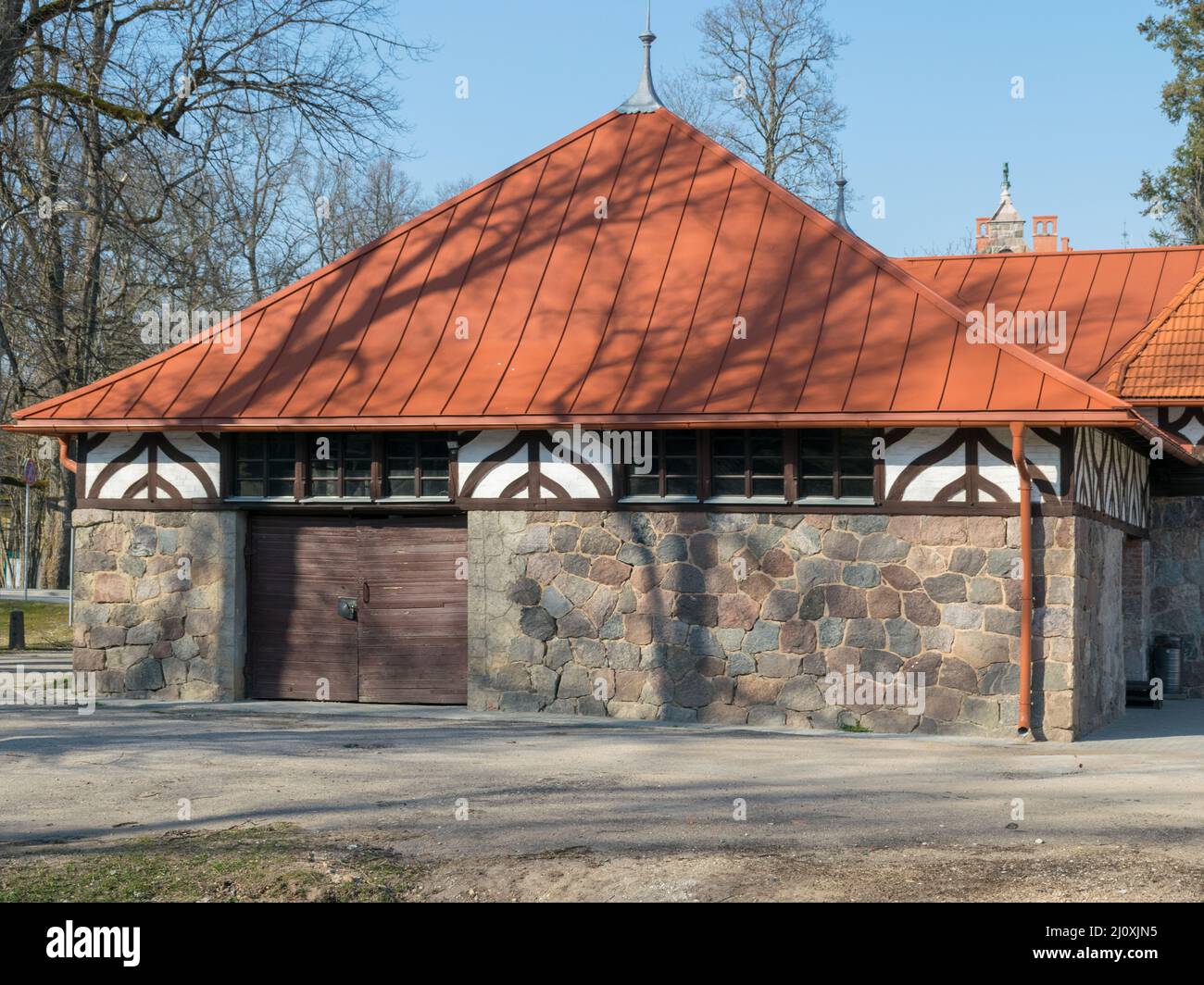 picture of an old stone house with a red roof Stock Photo - Alamy