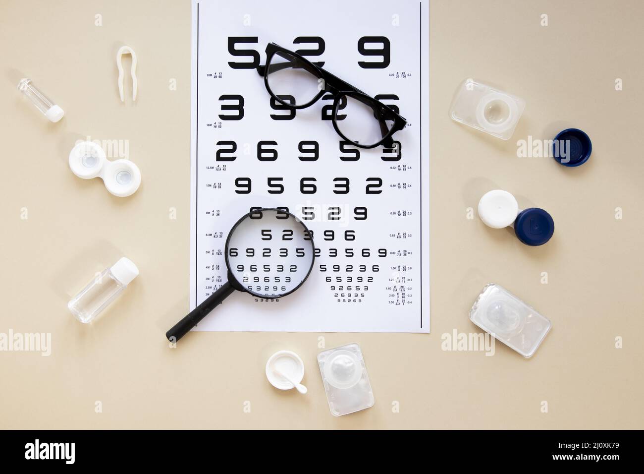 Top view eye care accessories beige background with numbers table. High quality beautiful photo concept Stock Photo