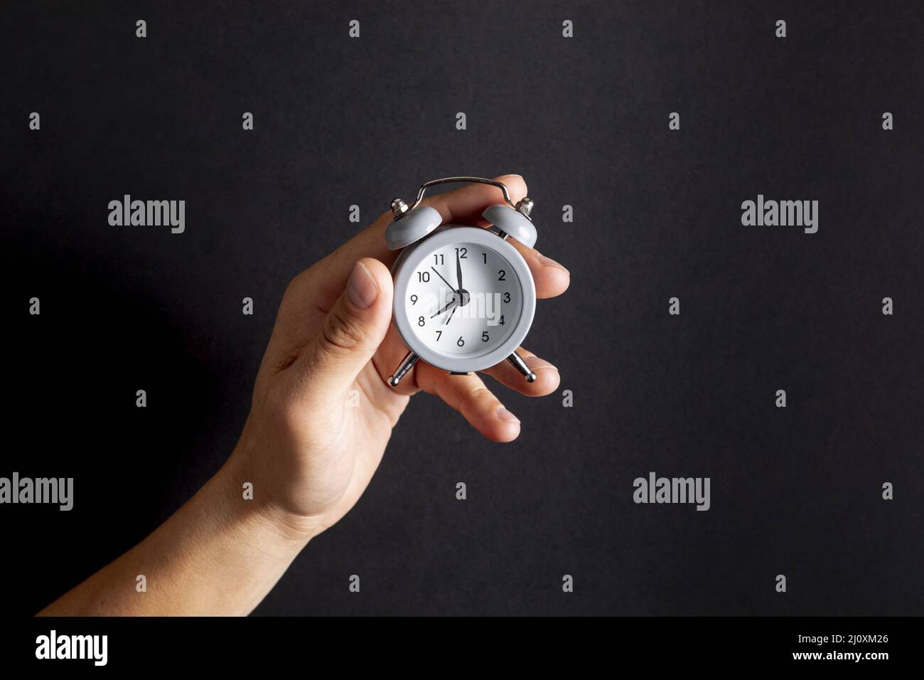 Hand holding clock hires stock photography and images Alamy
