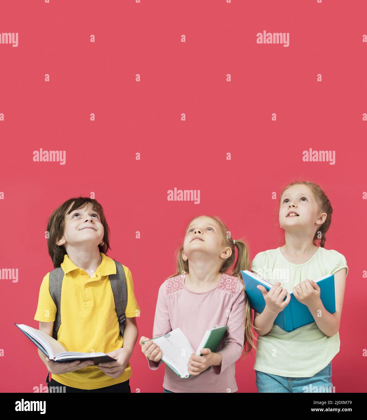 Little kids looking up together. High quality beautiful photo concept Stock Photo