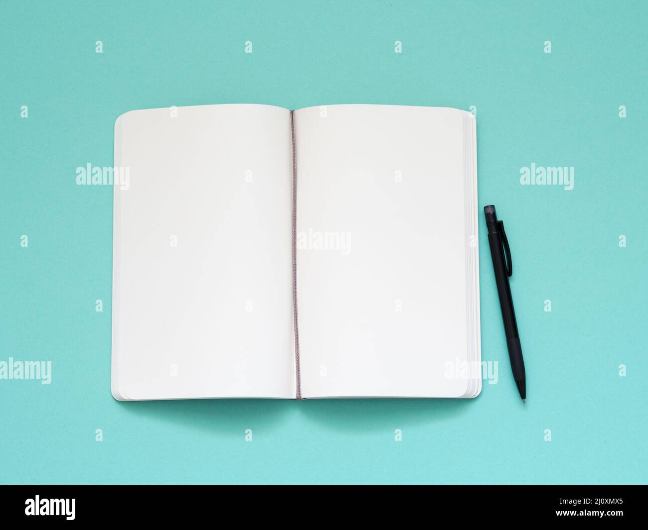 Open notepad with a clean white page Stock Photo