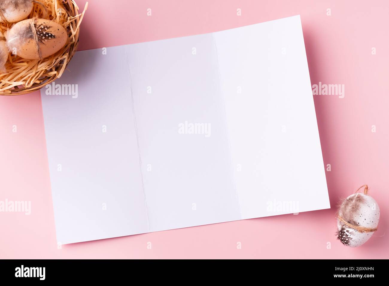 Easter greeting card design. Easter brochure mockup with decorative Easter eggs Stock Photo