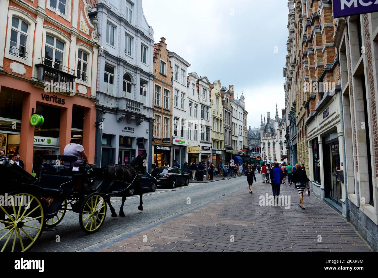 A horse carriage on Steenstraat in the historical center of Bruges, Belgium. Stock Photo