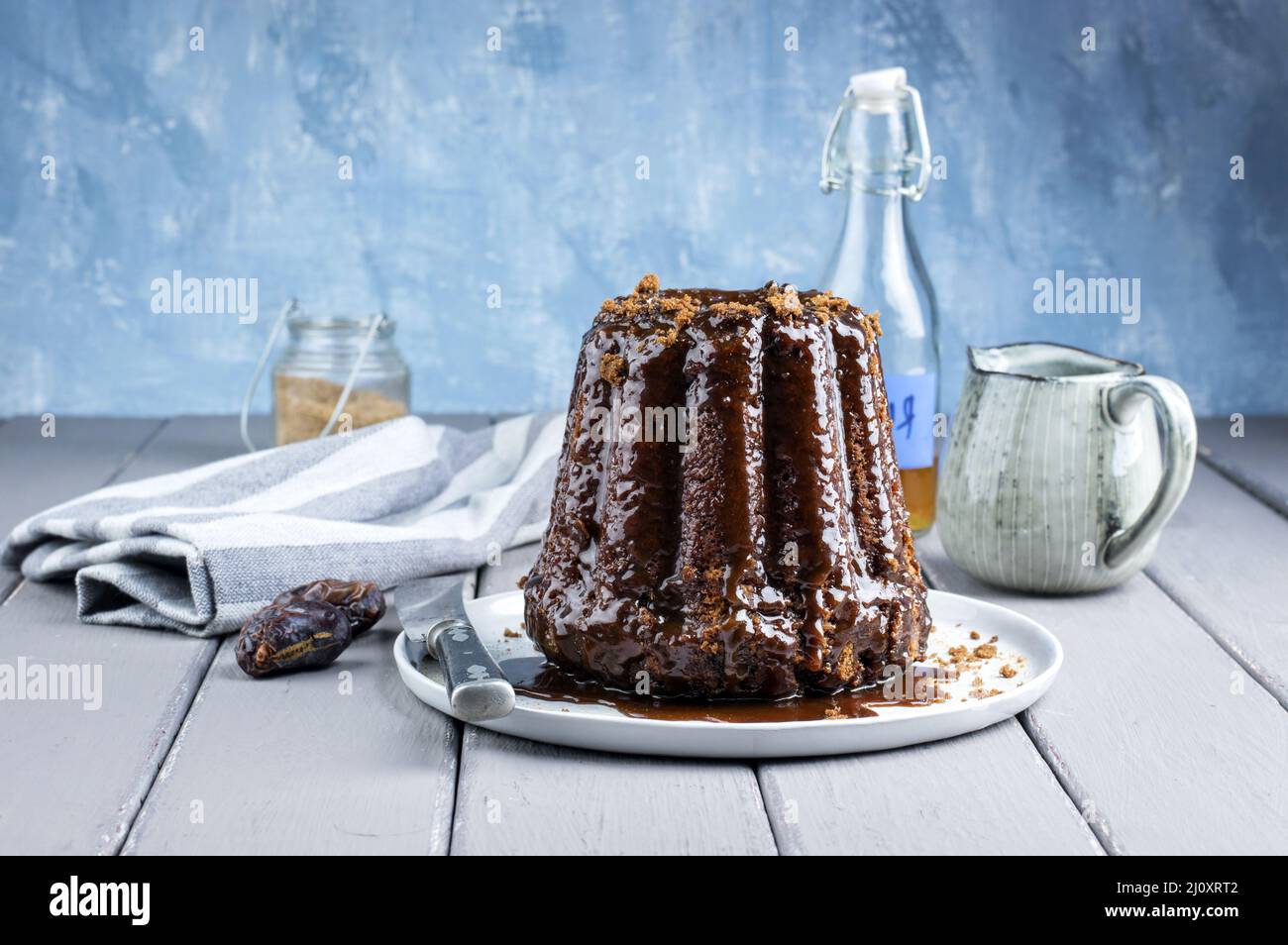 Traditional English sticky toffee pudding with caramel glaze served as ...