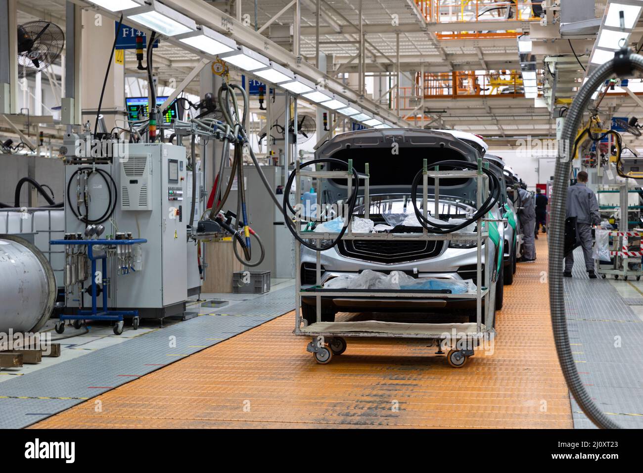 Car bodies are on assembly line. Factory for production of cars. Modern