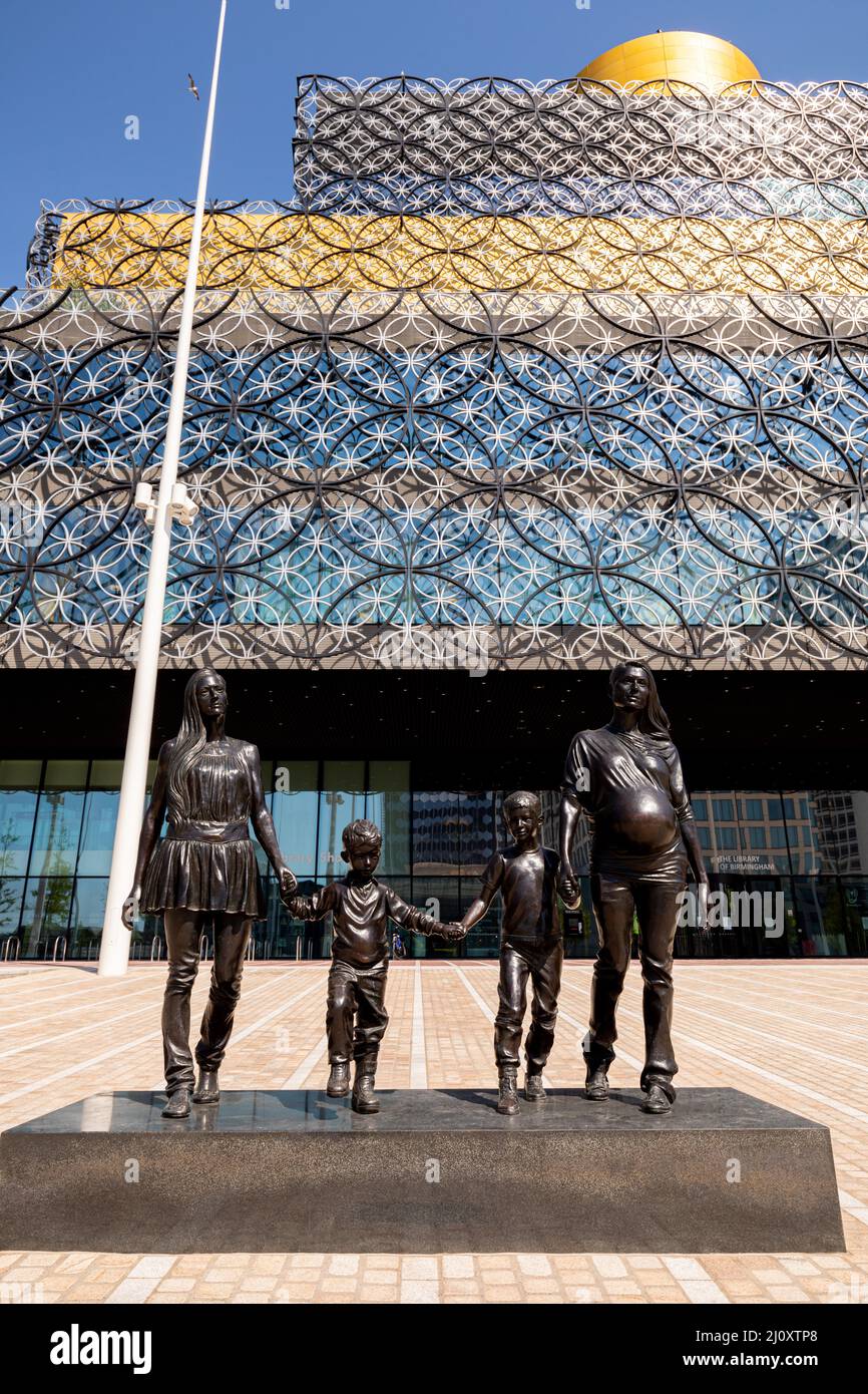 UK Birmingham City Centre in the sun with the regeneration of Centenary Square with the library statue by Turner Prize-winning artist Gillian Wearing Stock Photo