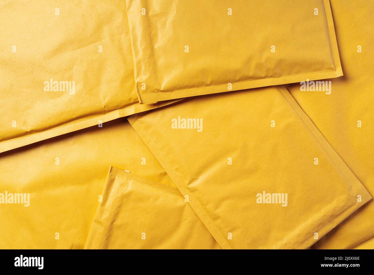 Lot of yellow paper postal envelopes. Top view Stock Photo Alamy