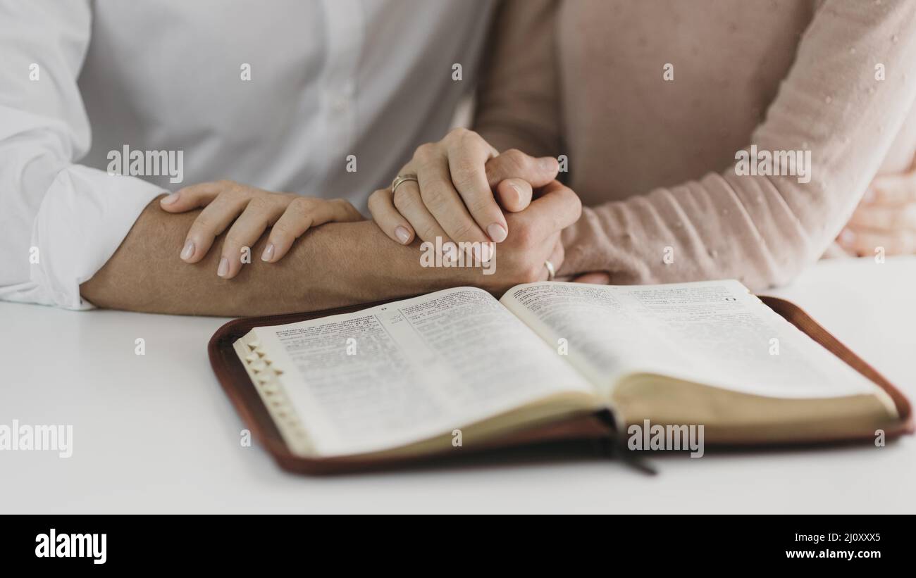Husband wife reading bible together. High quality photo Stock Photo