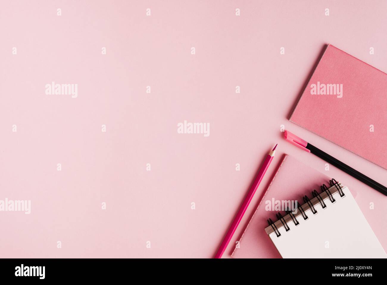 Pink office supplies colored surface. High quality photo Stock Photo