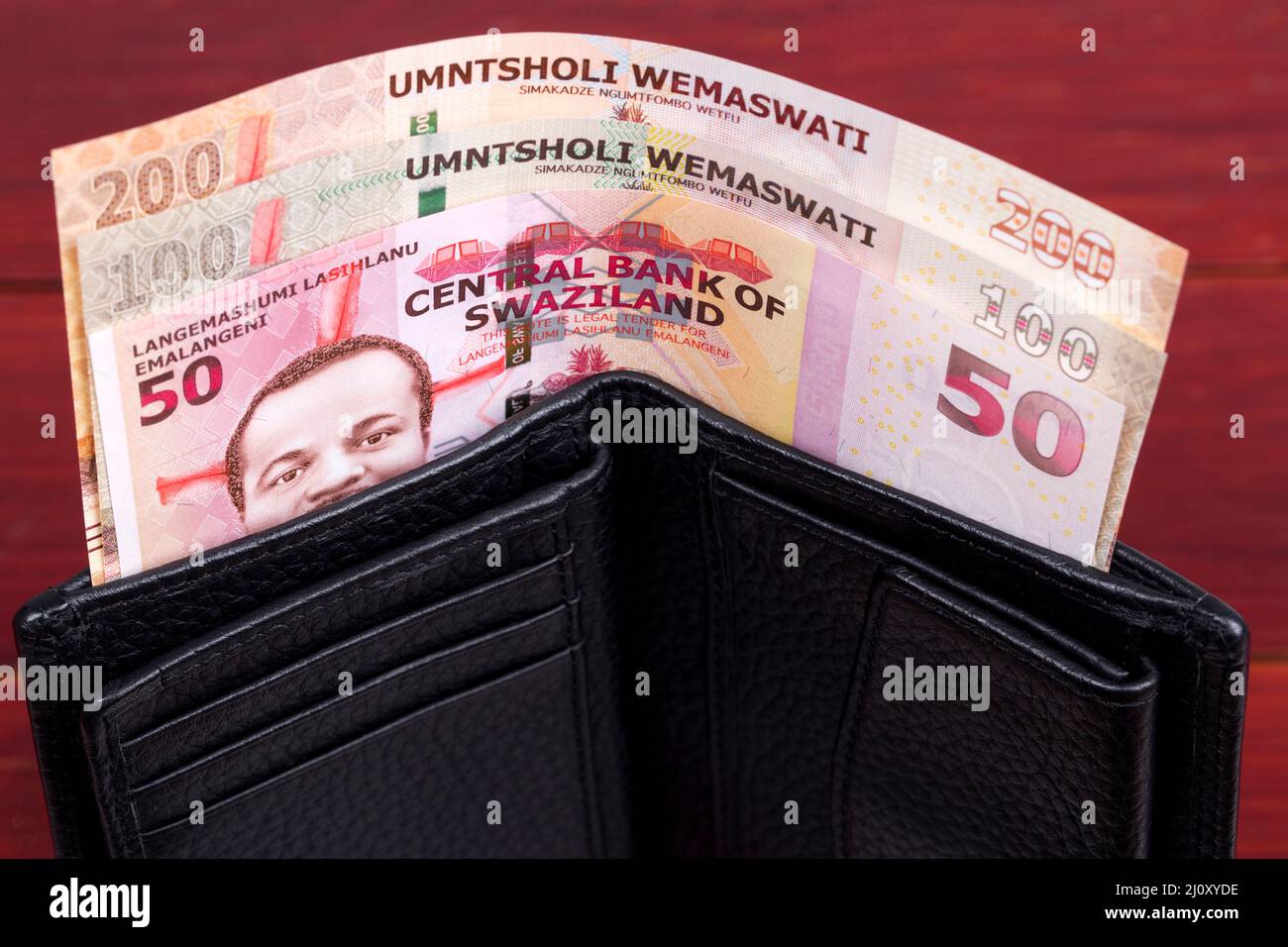 Swazi money - lilangeni in the black wallet Stock Photo