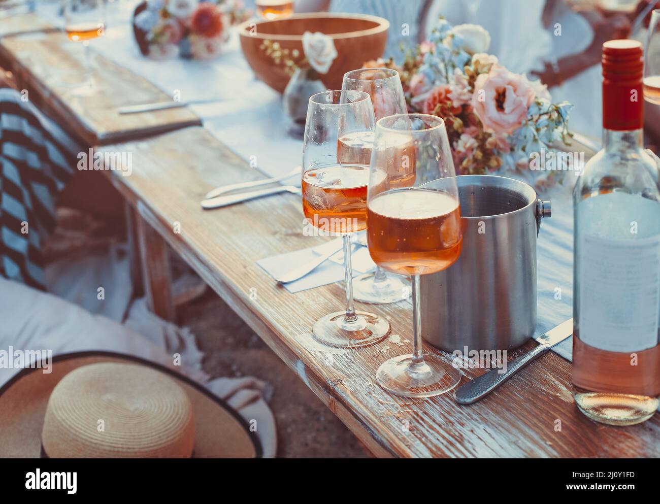 Delicious food and flowers for outdoor summer picnic Stock Photo