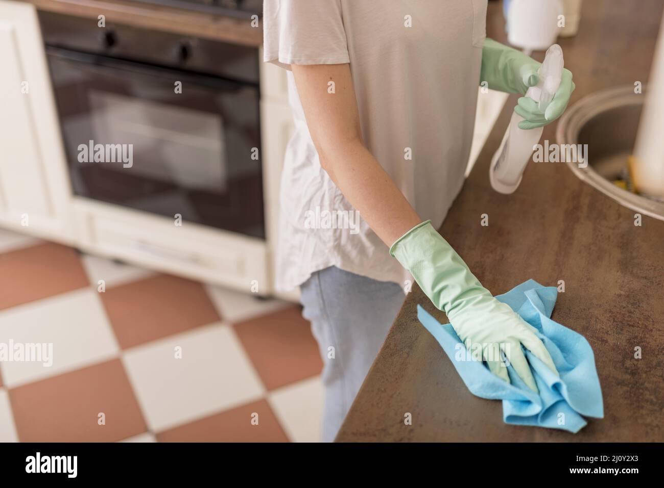 Side view woman cleaning kitchen surface. High quality photo Stock Photo Alamy