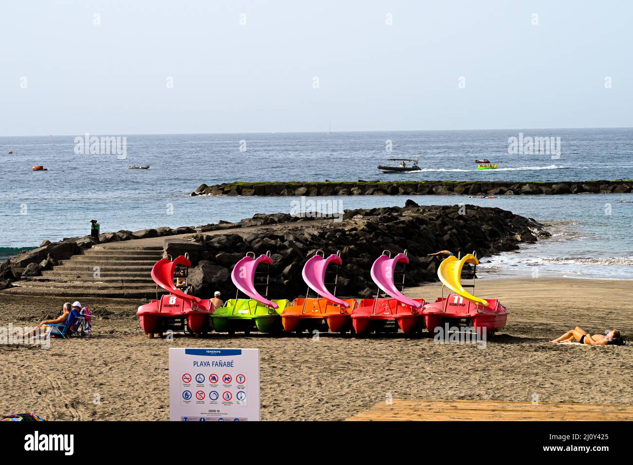 A row of slide Pedalo boats won a beach in Costa Adeje, Tenerife with