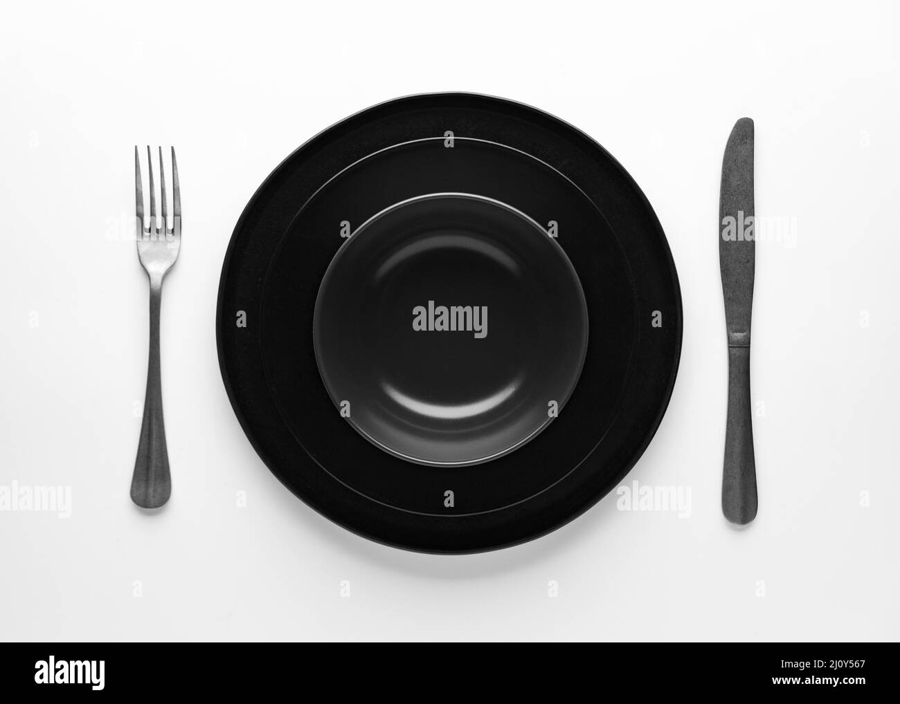 Flat lay dark dinnerware cutlery. High quality photo Stock Photo