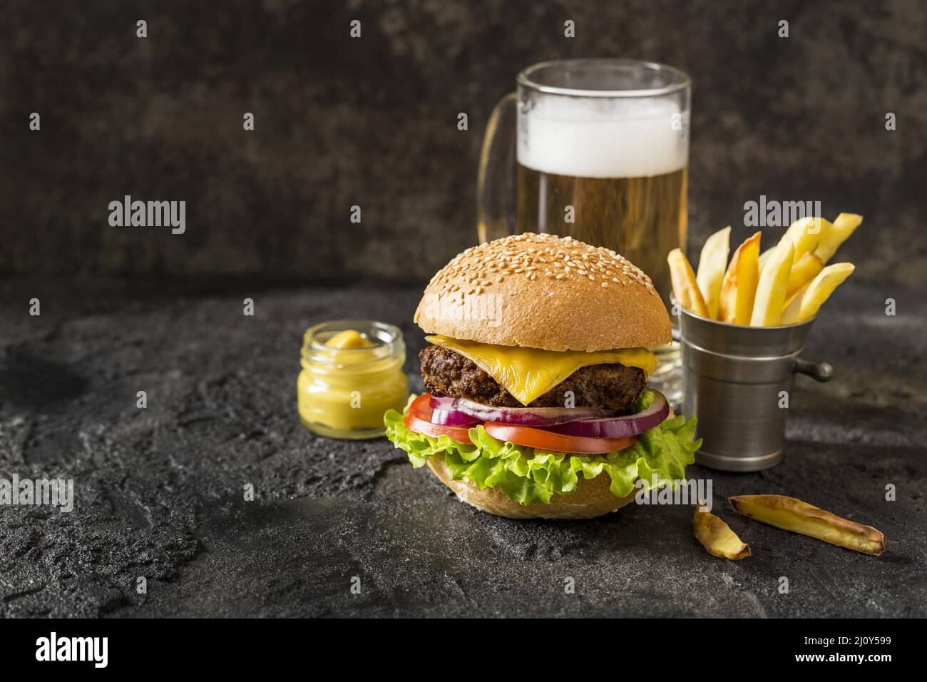 Front view beef burger fries sauce beer. High quality photo Stock Photo