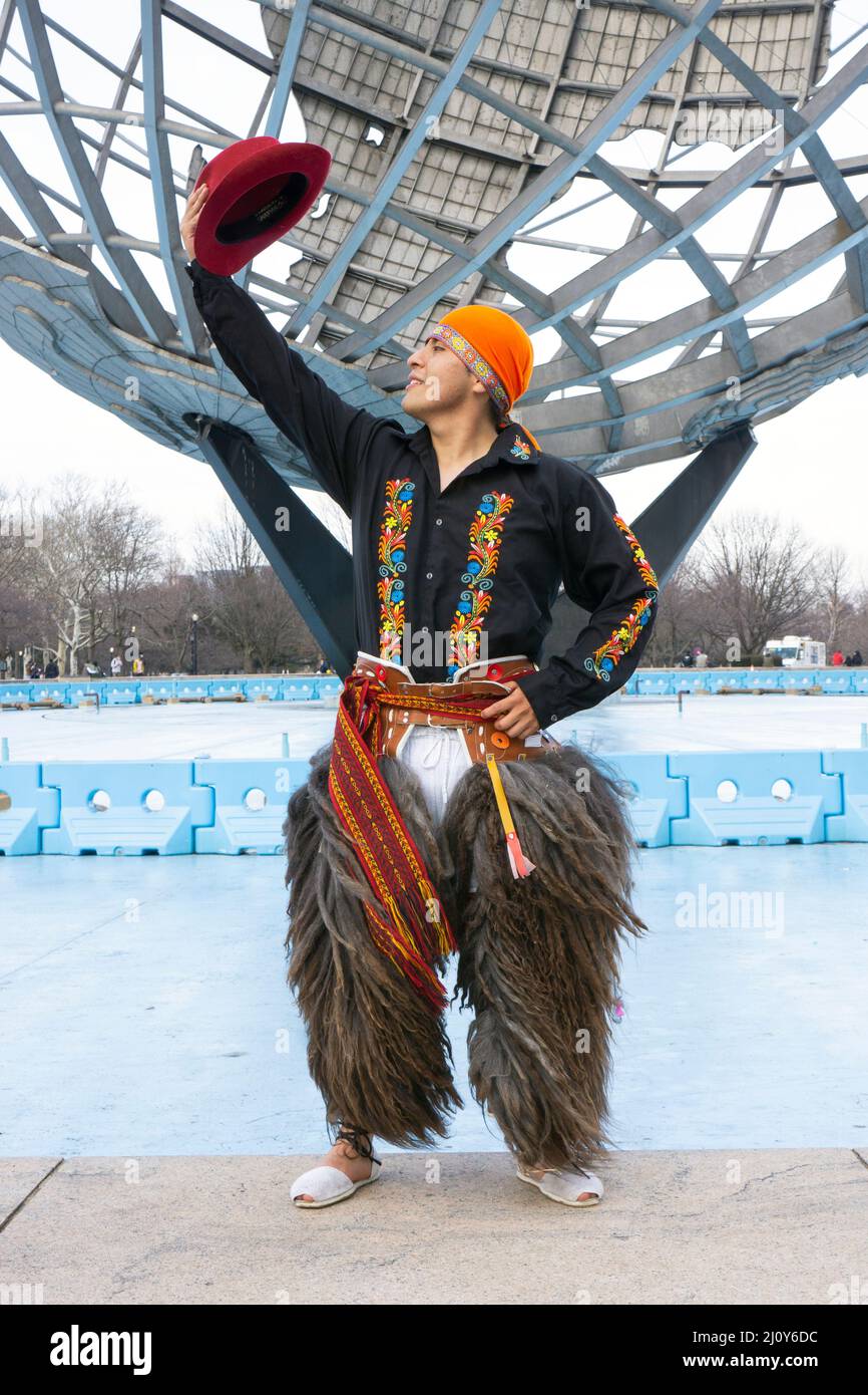 Posed portrait  of a member of Jatary Muzhucuna, an Ecuadorian American music & dance troupe,. Near the unisphere in a park in Queens, New York City. Stock Photo