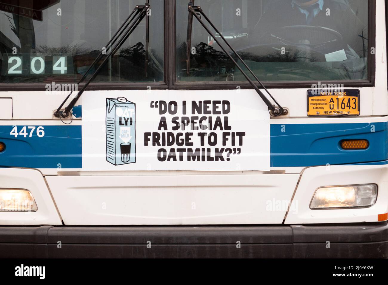 A quirky funny irreverent Oatly oat milk ad on the front of a New York City bus in Queens New York City. Stock Photo
