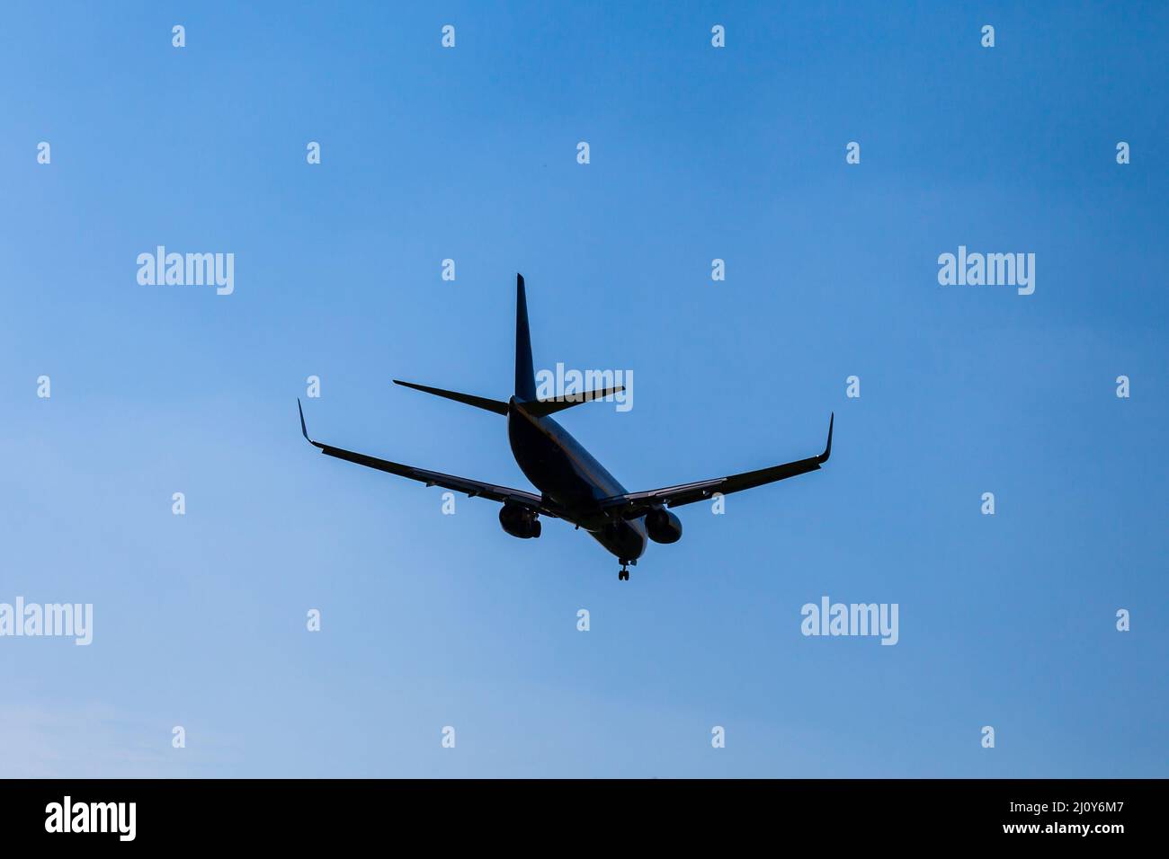 Commercial airliner landing or taking off. Stock Photo