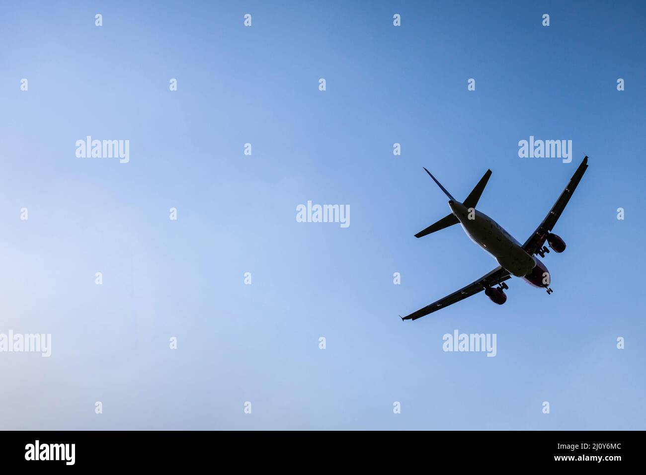 Commercial airliner landing or taking off. Stock Photo