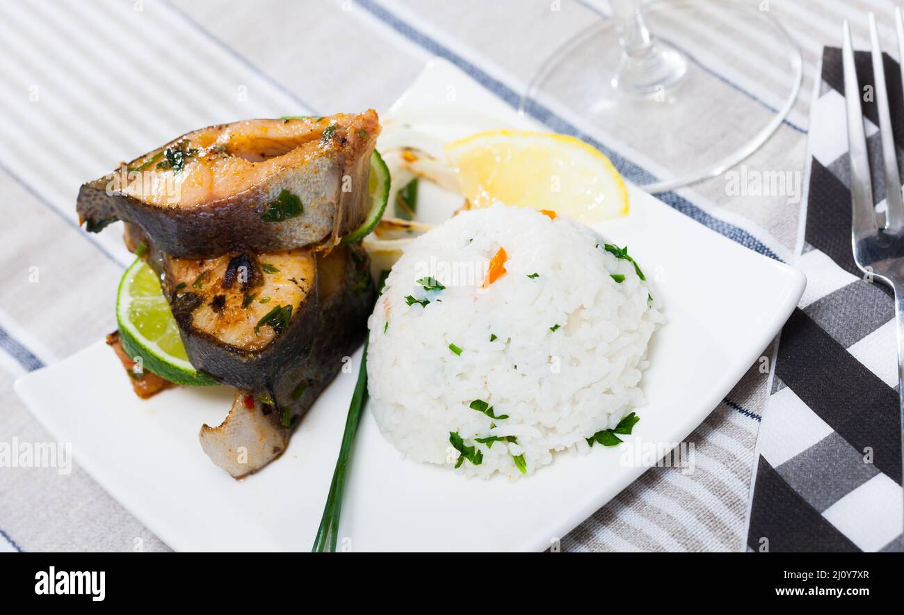 Baked trout steaks with white rice Stock Photo Alamy